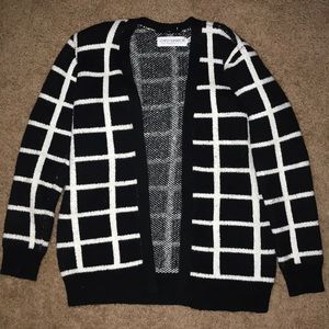 thick, long sleeved black and white cardigan